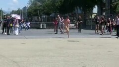 Nude man runs around a public square and gets attention Thumb