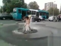 Nude chick washing her pussy on the street Thumb