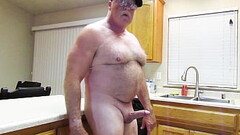 Standing naked in the kitchen Thumb