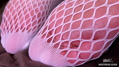 Goddess foot teasing in cute white fishnets on the bed Thumb