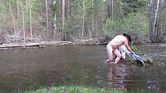 Bathing naked in the river. Thumb