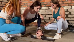 Three Girls Spitting On A Slave Captive In Dirty Basement Thumb